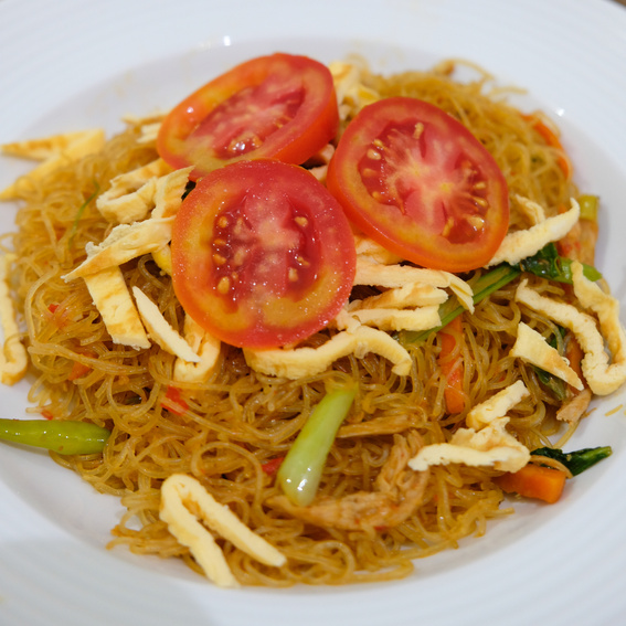 Bihun goreng or fried vermicelli served in a plate.