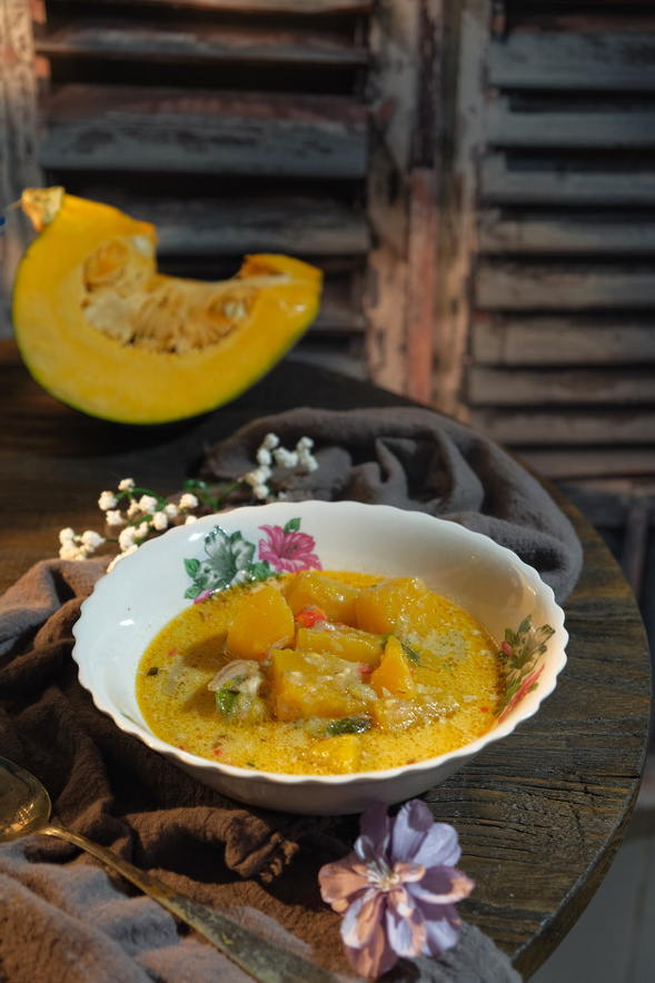 Homemade of Masak Lemak Labu over dark background